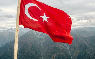 Stylized mountain peaks symbolizing active lifestyle